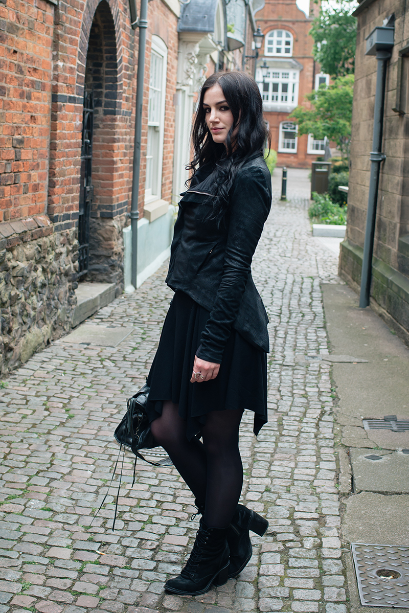 Dark style fashion blogger Stephanie of FAIIINT wearing Rick Owens Naska blistered lamb leather jacket, Helmut Lang drape skirt, Kurt Geiger saturn boots, Balenciaga city bag. All black street style outfit.