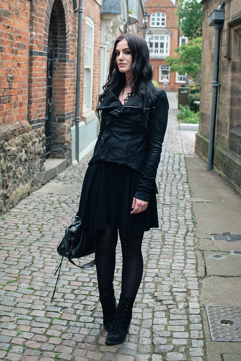 Dark style fashion blogger Stephanie of FAIIINT wearing Rick Owens Naska blistered lamb leather jacket, Helmut Lang drape skirt, Kurt Geiger saturn boots, Balenciaga city bag. All black street style outfit.