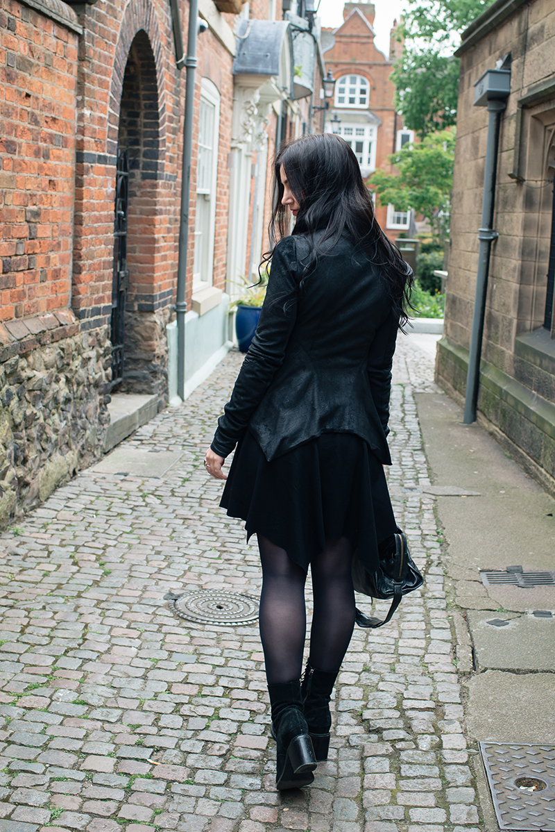 Dark style fashion blogger Stephanie of FAIIINT wearing Rick Owens Naska blistered lamb leather jacket, Helmut Lang drape skirt, Kurt Geiger saturn boots, Balenciaga city bag. All black street style outfit.