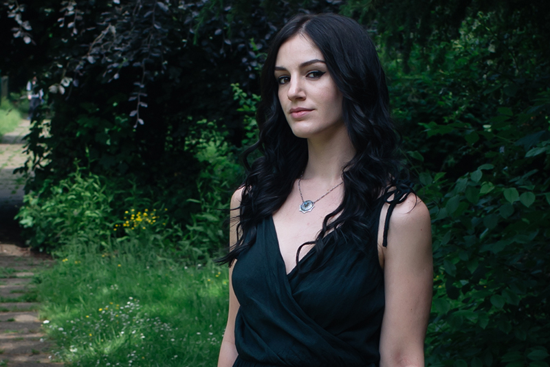 Fashion blogger Stephanie of FAIIINT wearing cotton wrap dress, Toilworn silver jewellery. Portrait all black outfit details.
