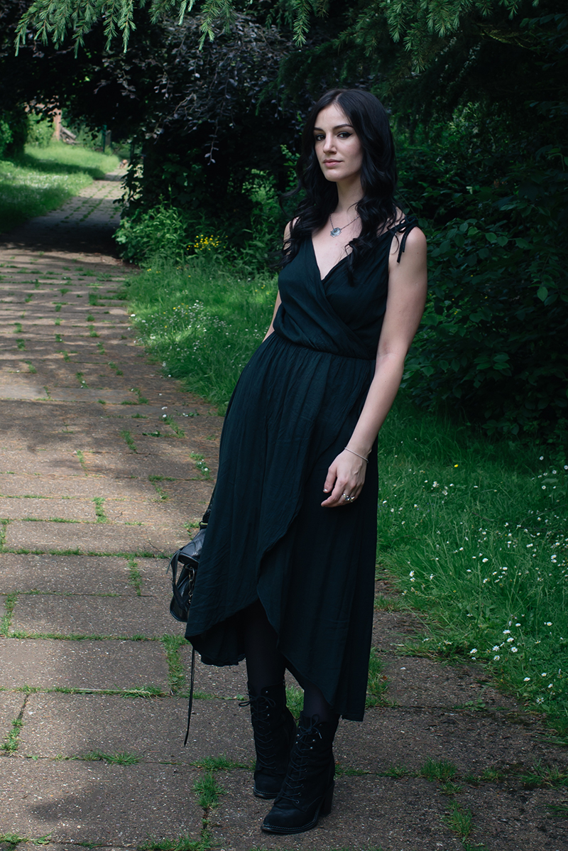 Fashion blogger Stephanie of FAIIINT wearing cotton wrap dress, Toilworn silver jewellery and Kurt Geiger Saturn lace up boots. All black dark fashion street style outfit.