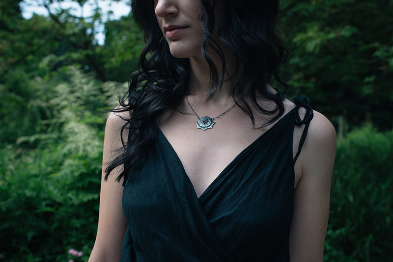Fashion blogger Stephanie of FAIIINT wearing cotton wrap dress, Toilworn silver luna landing labradorite moon necklace. All black dark style outfit details.