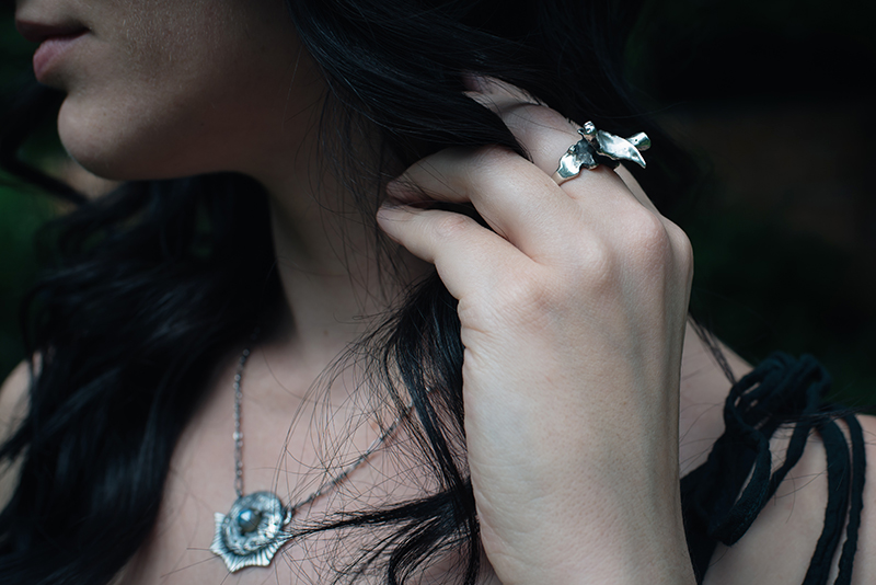 Fashion blogger Stephanie of FAIIINT wearing Toilworn silver vertebra ring and labradorite moon necklace. All black dark style outfit details.
