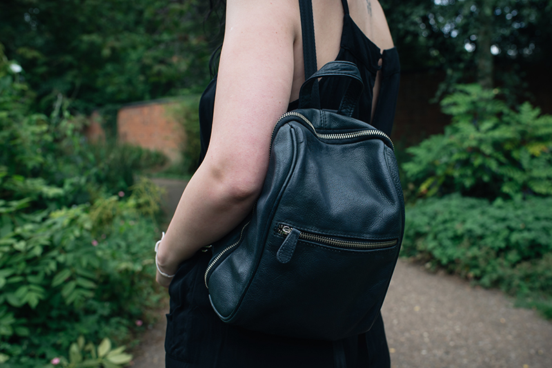 Fashion blogger Stephanie of FAIIINT wearing New Look leather backpack. All black everything outfit details.
