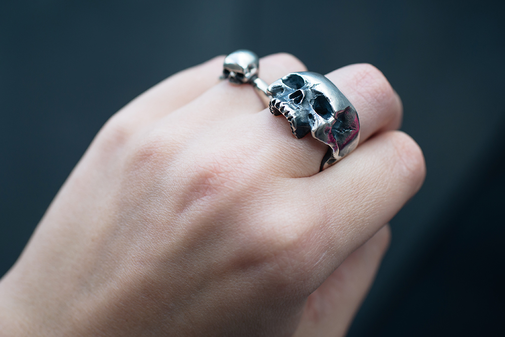 Fashion blogger Stephanie of FAIIINT wearing Toilworn jewellery large silver skull ring and mini skull ring. Goth outfit details.