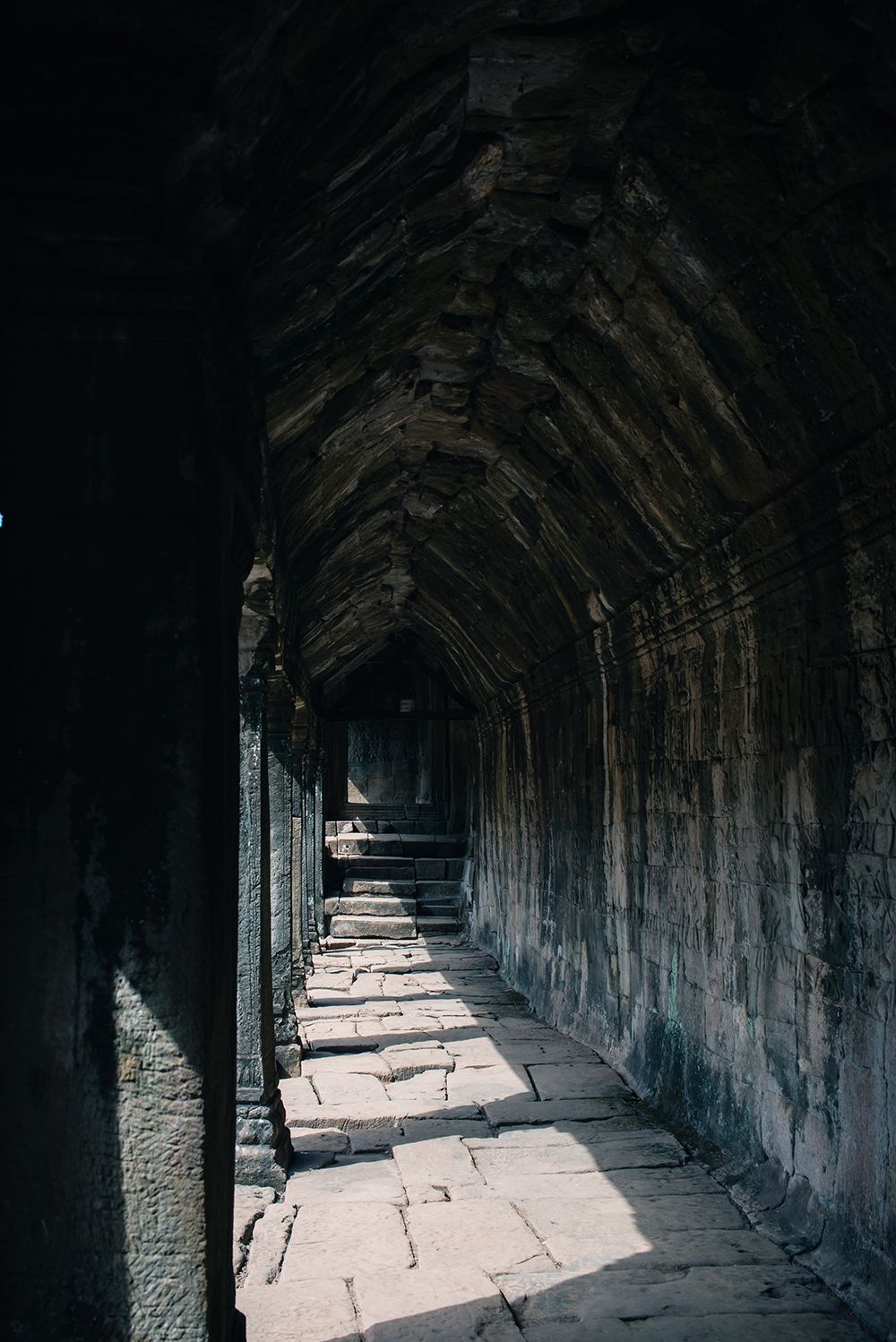 Bayon temple ruins Siem Reap Angkor Cambodia, corridor with sunlight.