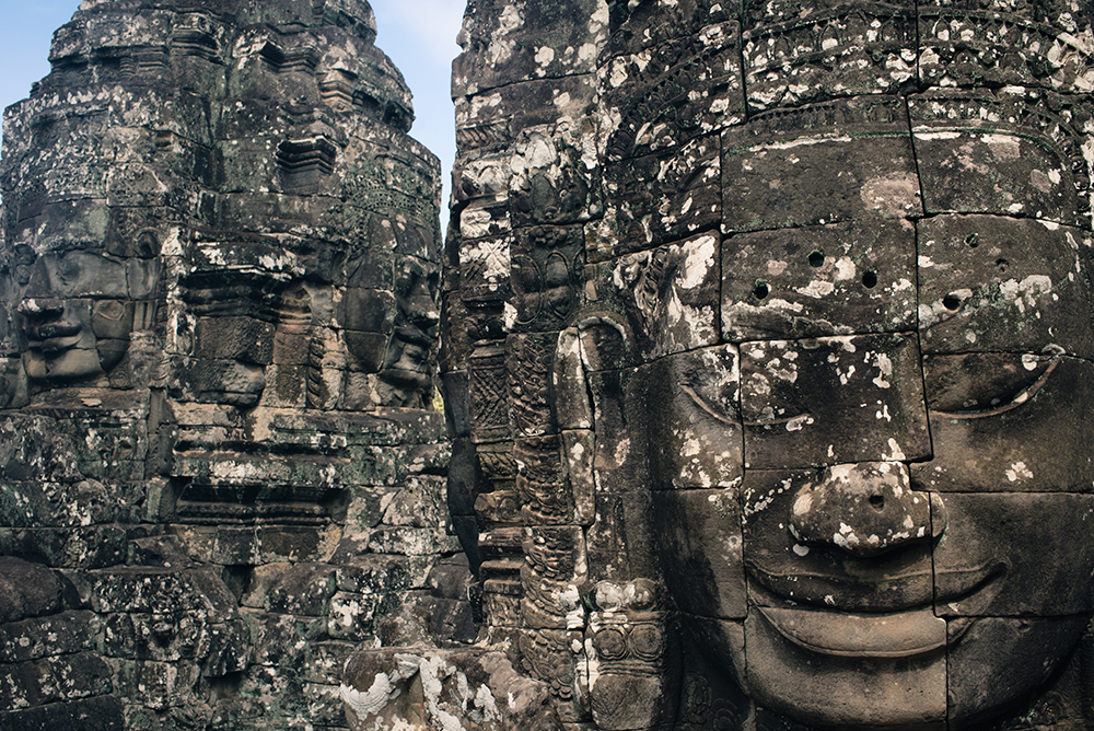 Bayon temple ruins Siem Reap Angkor Cambodia, faces sculptures.