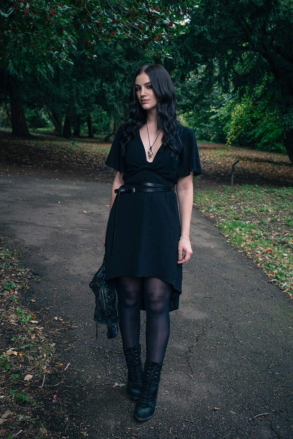 Fashion blogger Stephanie of FAIIINT wearing Tobi high low dress with cropped kimono wrap top, All Saints double belt, Quartz necklace, Kurt Geiger Saturn lace up boots. All black dark street style outfit.