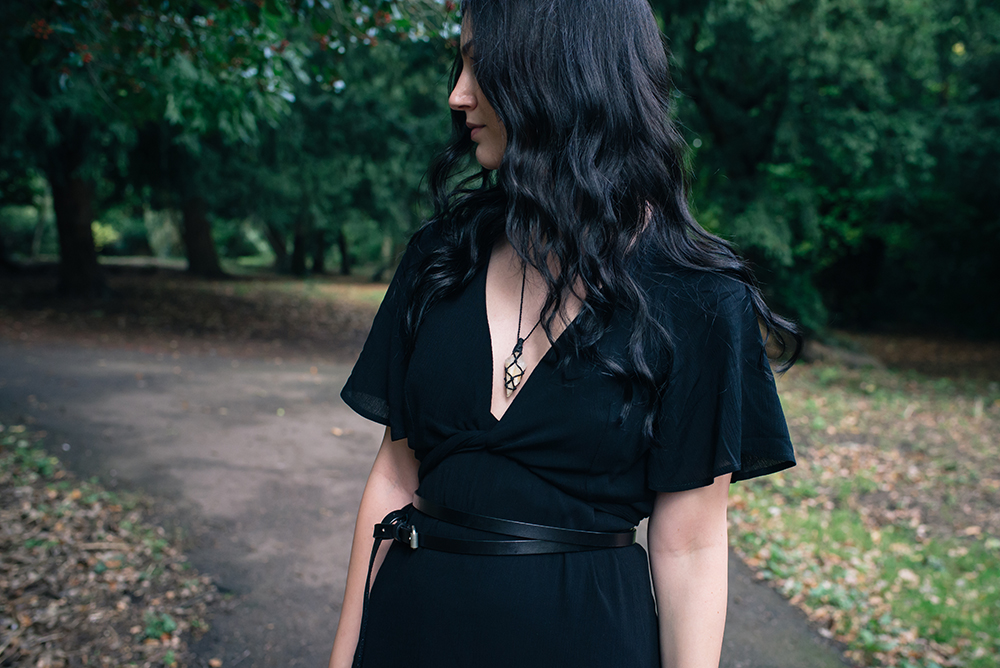 Fashion blogger FAIIINT wearing braided raw quartz necklace from Cambodian market, Tobi black summer dress and cropped kimono wrap top, All Saints double wrap around belt. Outfit details.