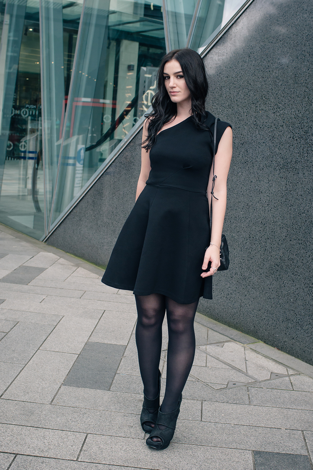 Fashion blogger Stephanie of FAIIINT wearing Reiss one shoulder asymmetric Keria dress with Rick Owens wave wedge shoes. All black outfit.