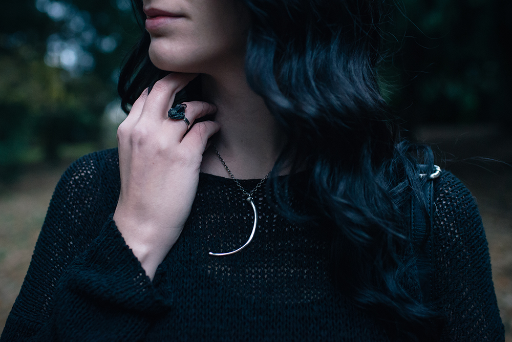 Fashion blogger Stephanie of FAIIINT wearing H&M black asymmetric knit jumper, Birds N Bones Jewelry Wyvern silver snake rib necklace, Elemental Luxury phantom quartz ring . All black autumn outfit details.