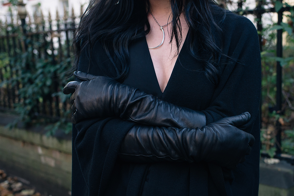 Fashion blogger Stephanie of FAIIINT wearing Black elbow length leather gloves and black cape. Outfit details.