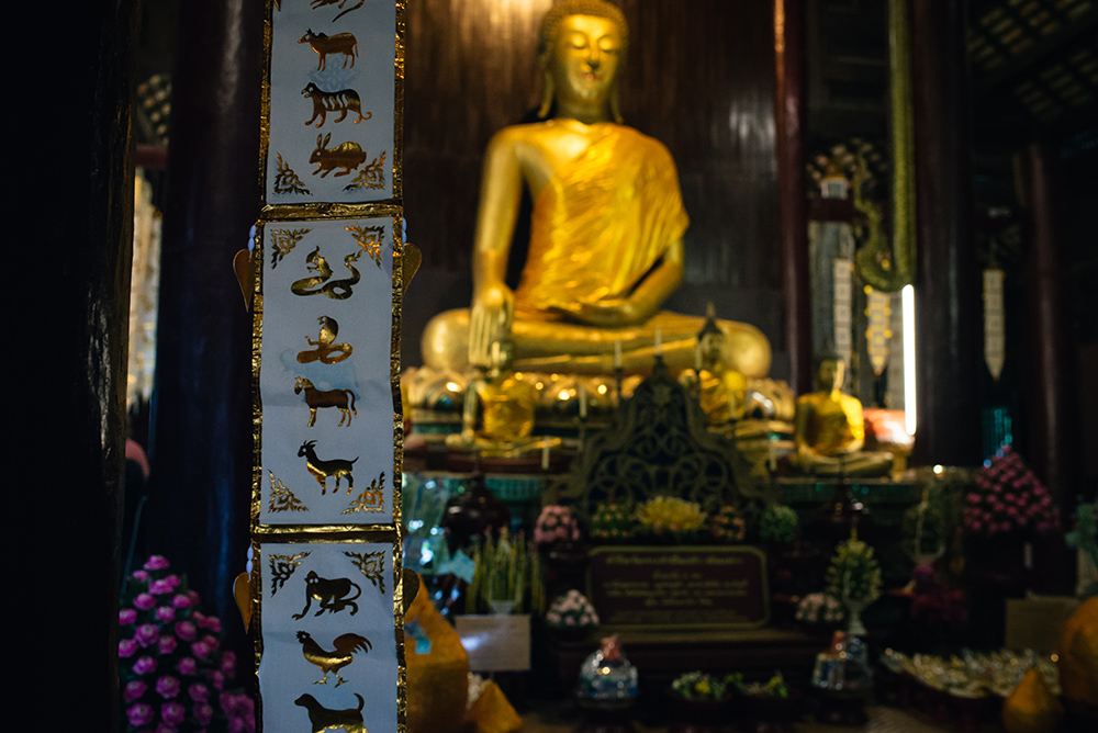 Wat Phan Tao wooden temple with golden Buddha Chiang Mai Thailand.