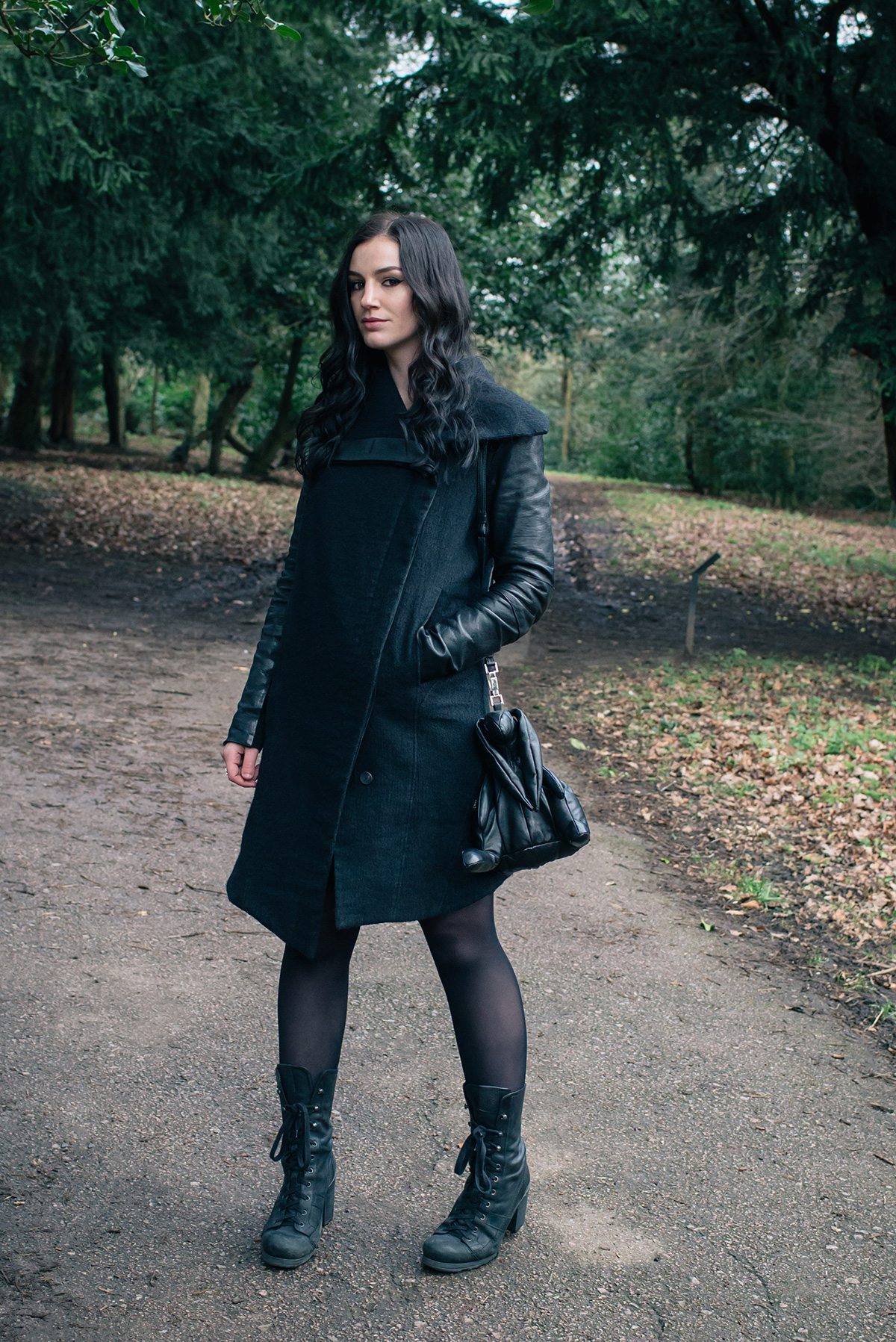 Fashion blogger Stephanie of FAIIINT wearing Helmut Lang Willowed wool and leather asymmetric coat, O.X.S. lace up boots, Christopher Raeburn Hare bag. All black dark style outfit.