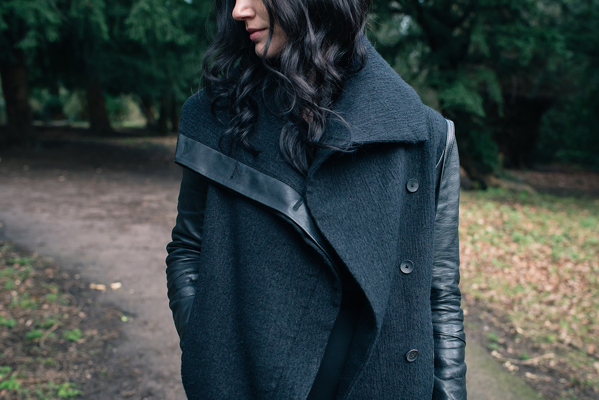 Fashion blogger Stephanie of FAIIINT wearing Helmut Lang Willowed wool and leather asymmetric coat. All black outfit details.