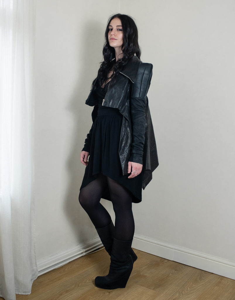Fashion blogger FAIIINT wearing all black outfit including Rick Owens black leather jacket and wedge boots.