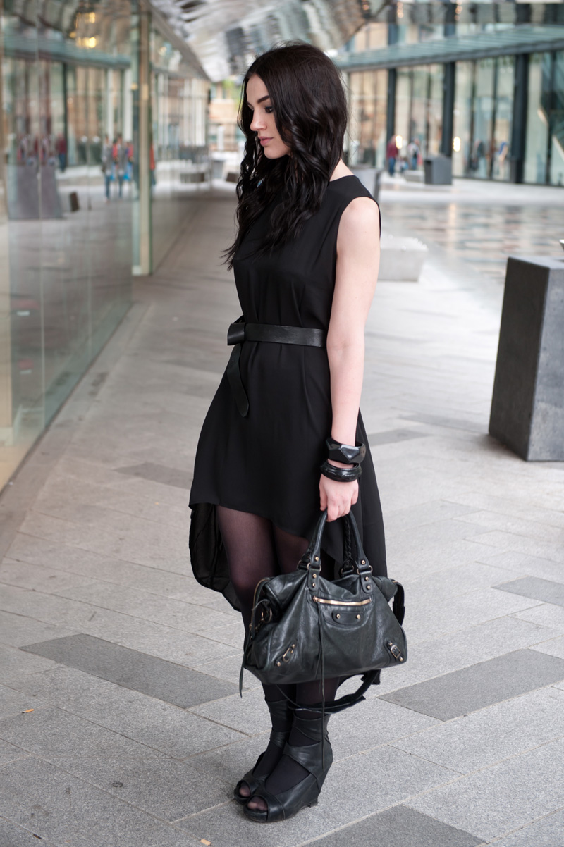 Fashion Blogger FAIIINT wearing Glamorous dip hem dress from MeeMee, H&M Knotted Belt, ASOS & Angie Gooderham bangles, Rick Owens wedges, balenciaga city, street style all black