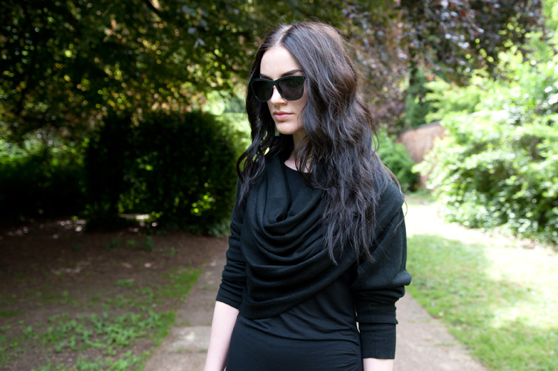Fashion blogger Stephanie Brown FAIIINT wearing Staple the label wrapped cardigan, Full Circle Dress, StylistPick Avery studded sneakers trainers, Le Specs 'Revolver' Sunglasses from Sunglasses Shop, Balenciaga City bag. Casual all black, dark style outfit.