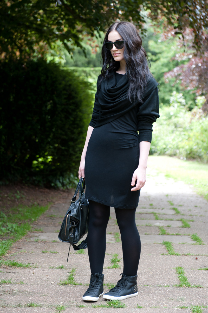 Fashion blogger Stephanie Brown FAIIINT wearing Staple the label wrapped cardigan, Full Circle Dress, StylistPick Avery studded sneakers trainers, Le Specs 'Revolver' Sunglasses from Sunglasses Shop, Balenciaga City bag. Casual all black, dark style outfit.